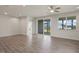 Spacious living room with hardwood floors, ceiling fan and lots of natural light at 280 Providence Creek Dr, Fuquay Varina, NC 27526