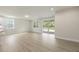 Open living room with hardwood floors, recessed lights and outdoor patio at 280 Providence Creek Dr, Fuquay Varina, NC 27526