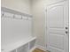 Mudroom with bench, coat hooks, and built-in shelving at 280 Providence Creek Dr, Fuquay Varina, NC 27526