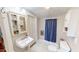 Bathroom with a white sink, cabinet, and a shower with a dark blue curtain at 308 College St, Oxford, NC 27565