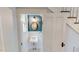 Quaint powder room featuring beadboard walls and a vintage pedestal sink at 308 College St, Oxford, NC 27565