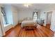 Inviting main bedroom with hardwood floors, neutral walls, and ample closet space at 308 College St, Oxford, NC 27565