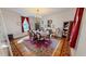 Elegant dining room featuring a fireplace, chandelier, and spacious layout at 308 College St, Oxford, NC 27565