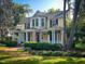 Beautiful two-story home with a welcoming porch, lush landscaping and front yard at 308 College St, Oxford, NC 27565