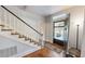 Foyer features an open front door with stained glass, wood floors and a staircase at 308 College St, Oxford, NC 27565