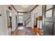 Welcoming foyer featuring wood floors, staircase, and paneled front door at 308 College St, Oxford, NC 27565
