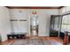 Foyer with hardwood floors, black door and access to living room at 308 College St, Oxford, NC 27565