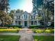 Well-maintained two-story home boasting a welcoming front porch and mature landscaping at 308 College St, Oxford, NC 27565