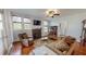 Cozy living room with hardwood floors, fireplace, and ample natural light at 308 College St, Oxford, NC 27565