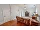Comfortable living room with a fireplace, plaid sofa, and hardwood floors at 308 College St, Oxford, NC 27565