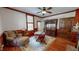 Inviting living room featuring wood trim, chair and antique hutch at 308 College St, Oxford, NC 27565
