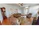 Living room with hardwood floors, a ceiling fan and multiple seating options at 308 College St, Oxford, NC 27565