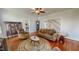 Inviting living room with hardwood floors, staircase, and vintage furnishings at 308 College St, Oxford, NC 27565