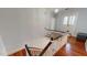 Classic staircase with wooden handrails and white trim leading to a bright landing at 308 College St, Oxford, NC 27565