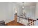 Second story landing with hardwood floors and stairway at 308 College St, Oxford, NC 27565