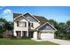 Charming two-story home features a well-manicured lawn, two-car garage, and classic architectural details at 310 Shiloh Way, Mebane, NC 27302