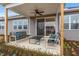 Cozy covered patio with outdoor seating, perfect for enjoying the serene surroundings at 312 Providence Creek Dr, Fuquay Varina, NC 27526
