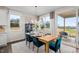 Bright dining area with view of backyard from slider and windows, including modern decor at 312 Providence Creek Dr, Fuquay Varina, NC 27526