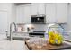 Close-up of a modern kitchen showcasing a stainless steel sink and stylish accessories at 312 Providence Creek Dr, Fuquay Varina, NC 27526