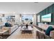 Inviting living room with stylish decor, plush seating, and large windows offering ample natural light at 312 Providence Creek Dr, Fuquay Varina, NC 27526