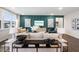 Well-appointed living room showcasing stylish decor, comfortable seating, and a trendy accent wall at 312 Providence Creek Dr, Fuquay Varina, NC 27526