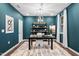 Stylish office with modern lighting, dark teal walls, and a plush rug, perfect for productivity at 312 Providence Creek Dr, Fuquay Varina, NC 27526