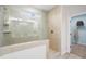 Modern shower featuring sleek tile work, glass enclosure, and a convenient niche for toiletries at 312 Providence Creek Dr, Fuquay Varina, NC 27526