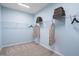 Spacious walk-in closet with ample shelving and hanging storage for optimal organization at 312 Providence Creek Dr, Fuquay Varina, NC 27526