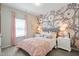 Charming bedroom with floral accent wall, plush bedding, and bright natural light at 34 E American Marigold Dr # 64, Benson, NC 27504