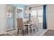 Charming dining area with stylish chandelier, a large window, and decor at 34 E American Marigold Dr # 64, Benson, NC 27504
