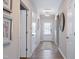 Inviting entryway with wood-look floors and a stylish light fixture and decor at 34 E American Marigold Dr # 64, Benson, NC 27504