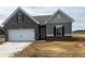 Charming single-Gathering home with a two-car garage and mixed brick and siding exterior at 34 E American Marigold Dr # 64, Benson, NC 27504