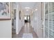 Inviting hallway with hardwood floors leading to an open living area with natural light at 34 E American Marigold Dr # 64, Benson, NC 27504