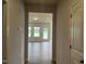 Bright hallway leads to a light-filled living area, showcasing the open layout of the home at 34 E American Marigold Dr # 64, Benson, NC 27504