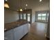 Well-lit kitchen with a granite island and adjacent dining area, ideal for Gathering meals at 34 E American Marigold Dr # 64, Benson, NC 27504