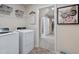 Well-organized laundry room with modern appliances and a doorway to the closet at 34 E American Marigold Dr # 64, Benson, NC 27504