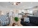 Open-concept living space connecting the living room and kitchen, with wood-look floors at 34 E American Marigold Dr # 64, Benson, NC 27504