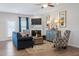 Comfortable living room with a fireplace, ample seating, and tasteful decor at 34 E American Marigold Dr # 64, Benson, NC 27504