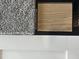 Display featuring coordinating carpet, flooring, and cabinet samples for interior design at 34 E American Marigold Dr # 64, Benson, NC 27504