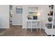 Bright office space with a modern desk, shelving, and artwork at 34 E American Marigold Dr # 64, Benson, NC 27504