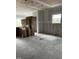 Spacious unfinished room showing drywall, concrete flooring, and boxed materials at 34 E American Marigold Dr # 64, Benson, NC 27504