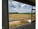 Screened porch view to the expansive yard beyond the home's construction area at 34 E American Marigold Dr # 64, Benson, NC 27504