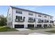 Row of modern townhomes with garages, balconies, and manicured front lawns, perfect for suburban living at 364 Church St, Morrisville, NC 27560