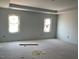 Unfinished bedroom with tray ceiling and large bright windows at 39 Atherton Circle, Angier, NC 27501