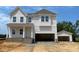 New two-story home with an attached two car garage and detached single car garage at 39 Atherton Circle, Angier, NC 27501
