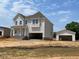 New two-story home with an attached two car garage and detached single car garage at 39 Atherton Circle, Angier, NC 27501
