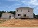 Exterior of home and detached garage with a wood patio at 39 Atherton Circle, Angier, NC 27501