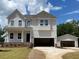 New two story home with attached and detached garages, manicured lawn, and white siding at 39 Atherton Circle, Angier, NC 27501