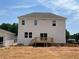 Exterior of home and detached garage with a wood patio at 39 Atherton Circle, Angier, NC 27501