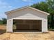 Spacious detached garage, perfect for extra storage or workshop space at 39 Atherton Circle, Angier, NC 27501